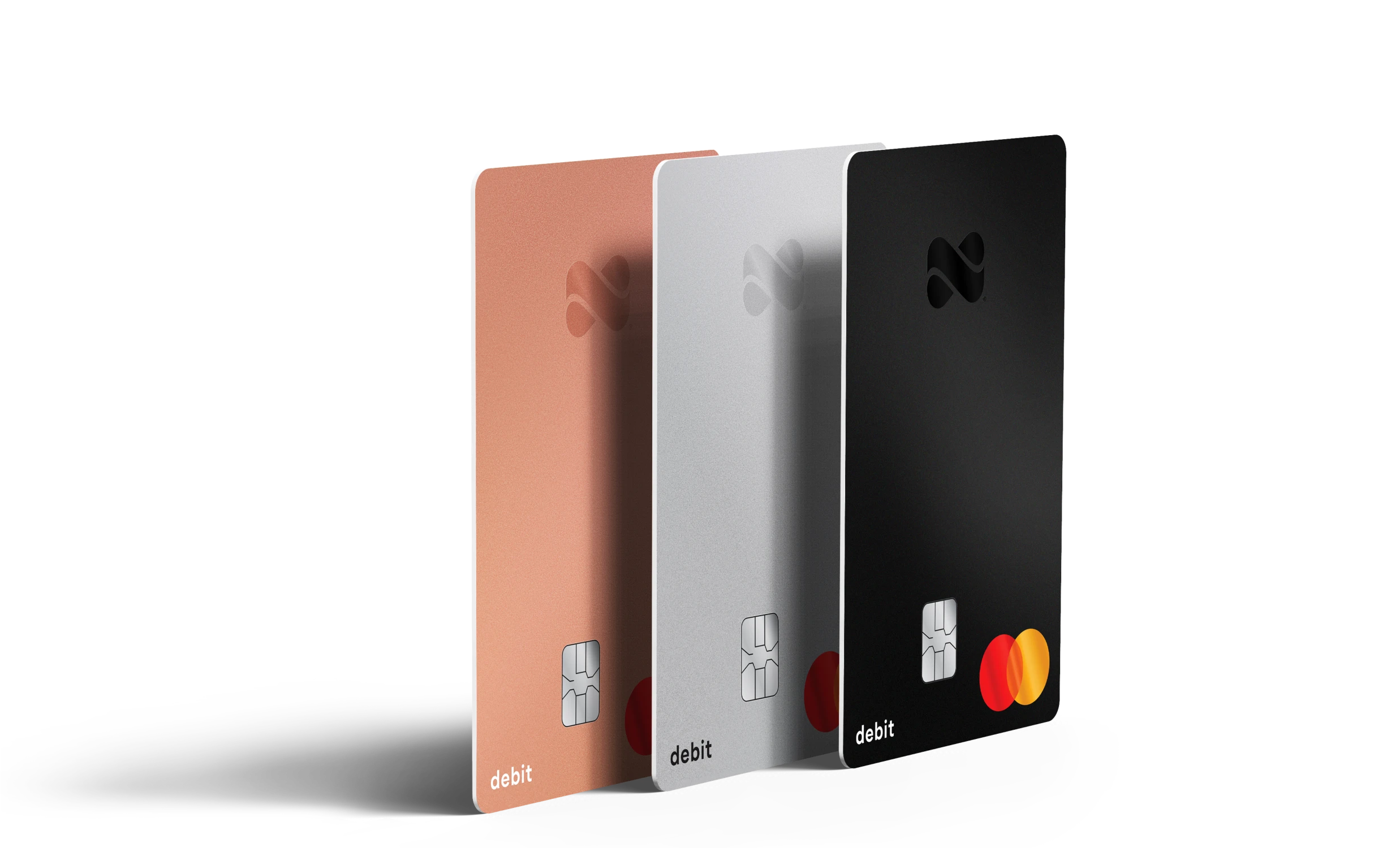 Netspend Debit Card in black, silver, and rose gold