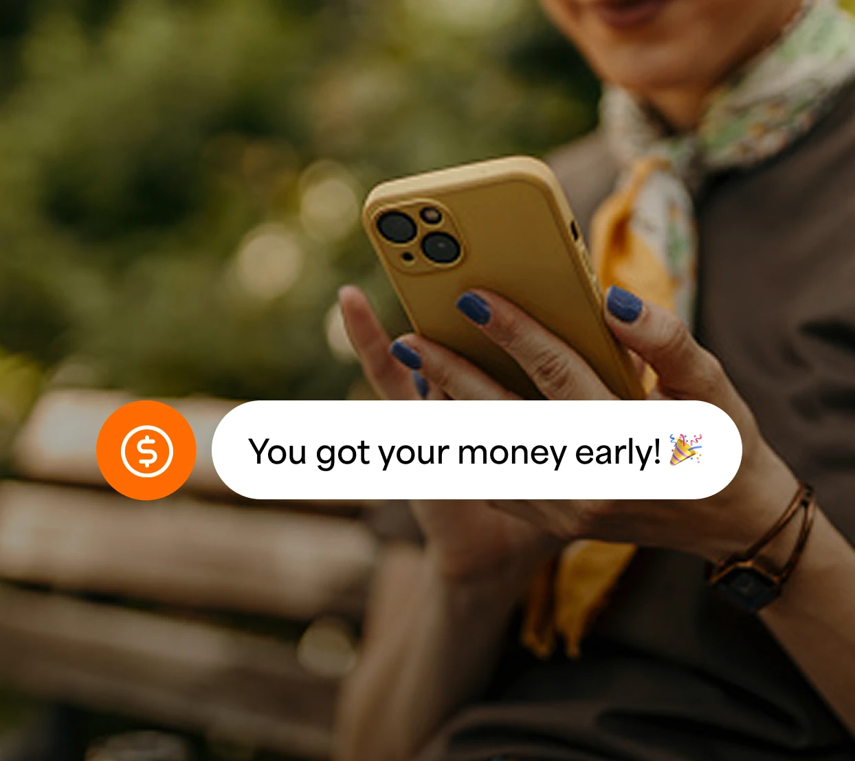 Person on a phone with a notification of getting their money early
