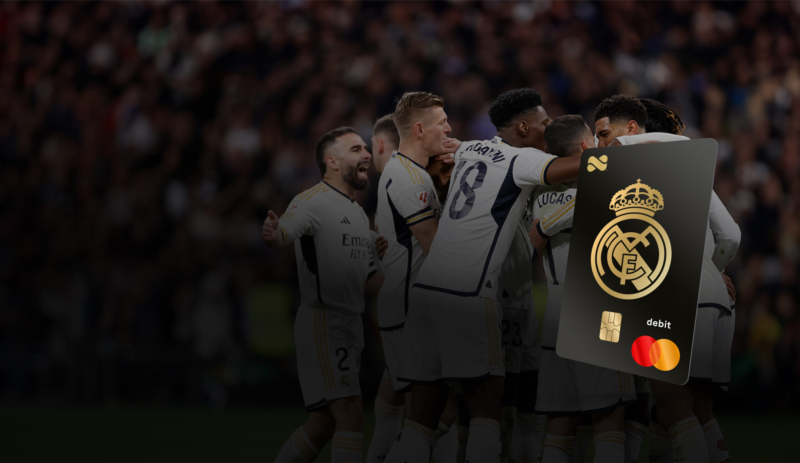 Netspend Real Madrid Mastercard overlayed in front of Real Madrid players huddled