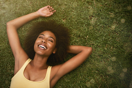 woman laying in grass